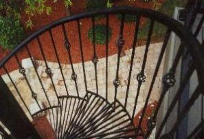 another spiral staircase with basket accents and radial grating treads