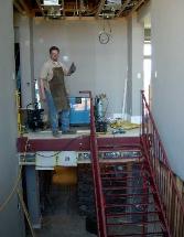 greg is welding this 4 story scissor staircase that will have  illuminated glass treads